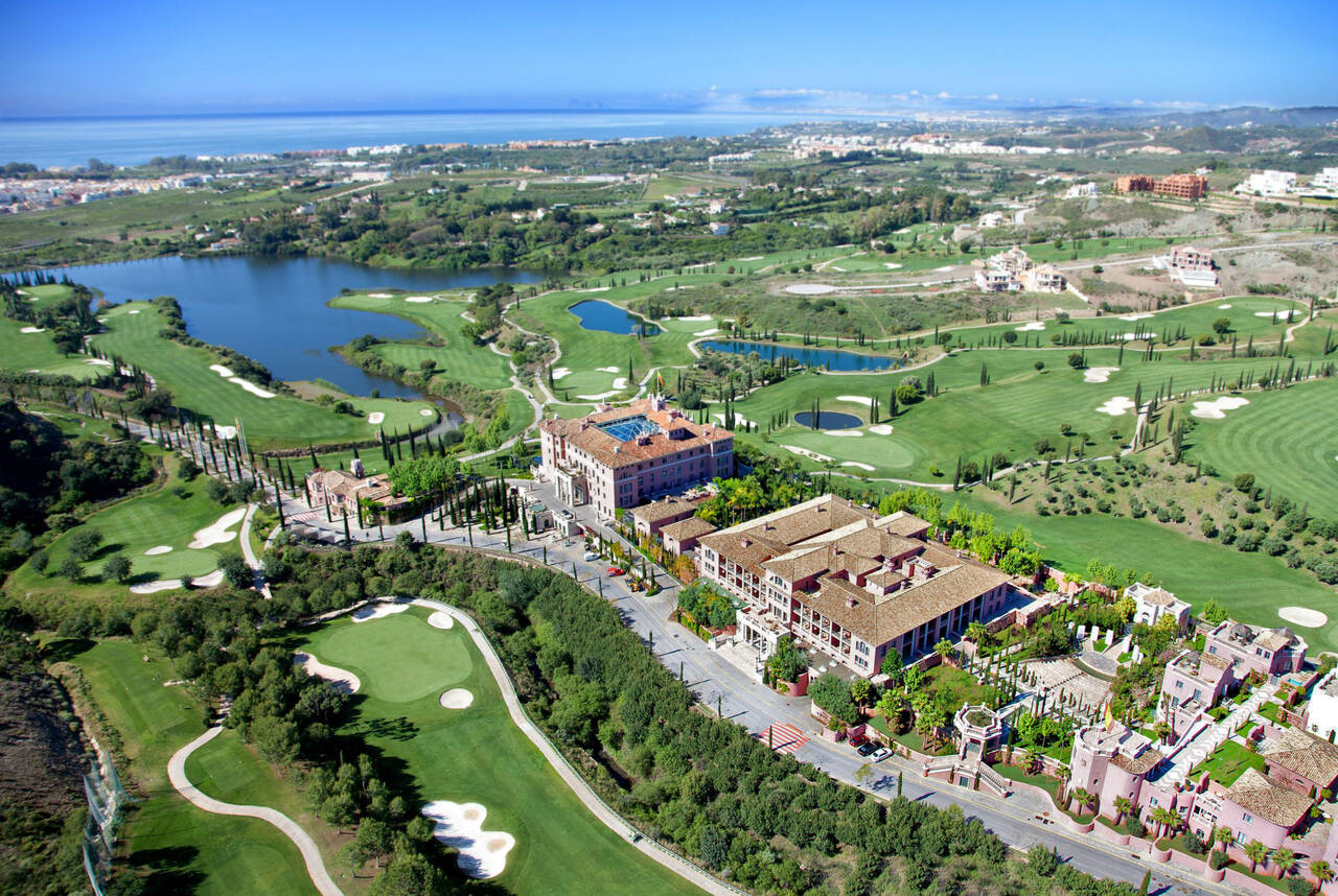 Mountain golf course in Benahavis with green fairways carved into the Sierra Bermeja landscape under bright Andalusian light